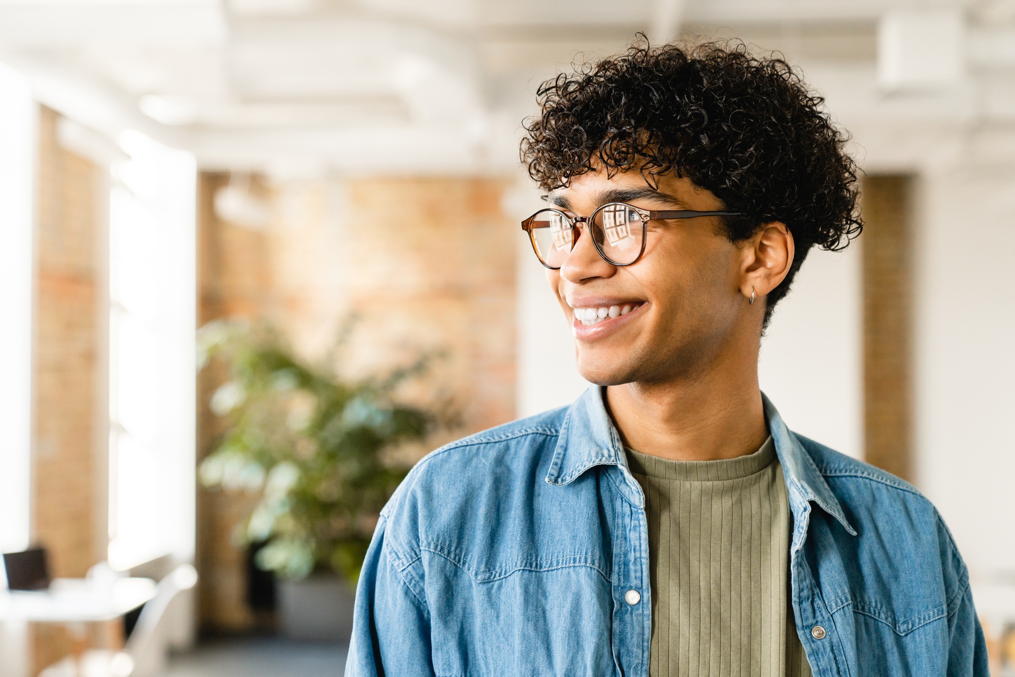 Smiling handsome african-american young man in the office